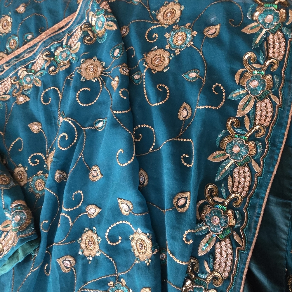 Beautiful Teal Color Gold Shimmering Georgette Sari With Gold Zardousi & Blouse